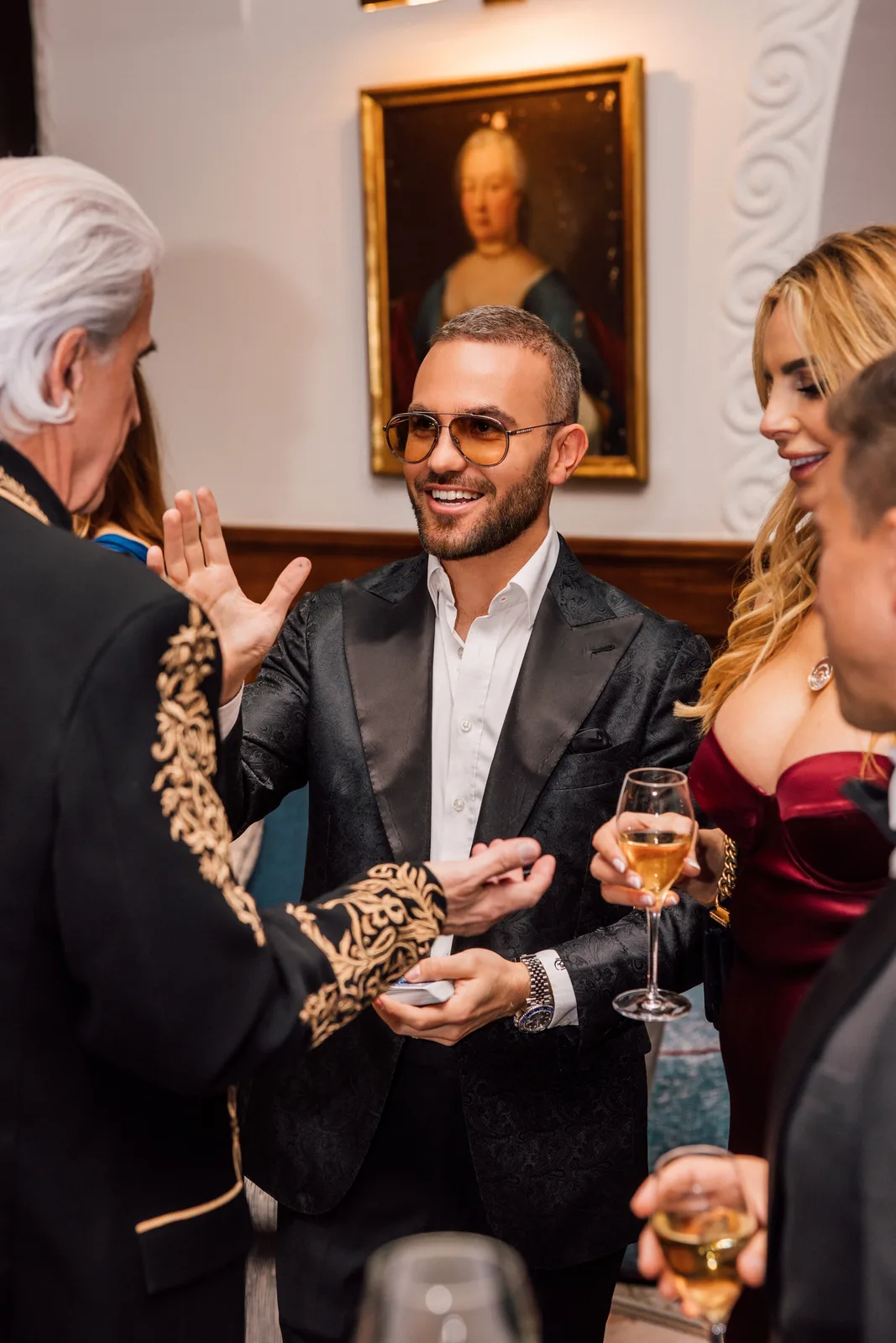 Matteo Cammisa performing for guests during the reception at Suvretta House, St. Moritz, beneath an antique portrait