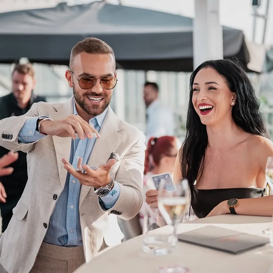 Matteo Cammisa performing tailored close-up magic at an evening event